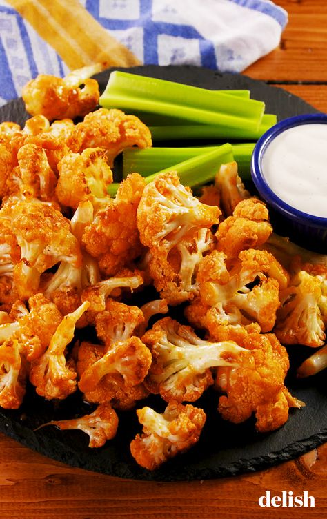 Buffalo Cauliflower Bites are perfect for your vegetarian friends. Get the recipe at Delish.com. #recipe #easy #easyrecipes #delish #cauliflower #buffalo #vegetarian #veggies #hotsauce #app #appetizer #gameday #superbowl #snack #healthy Baked Cauliflower Bites, Vegan Buffalo Cauliflower, Buffalo Cauliflower Bites, Buffalo Cauliflower, Cauliflower Bites, Superbowl Snacks, Low Carb Meal, Super Bowl Food, Cauliflower Recipes