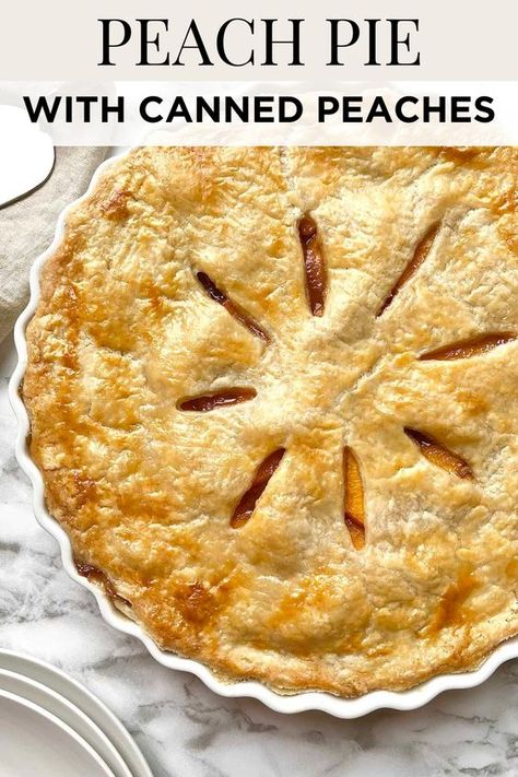 This fresh peach pie recipe is made with a homemade flaky pie crust that's baked to perfection with a sweet peach pie filling made from canned peaches, sugar, cinnamon, nutmeg, vanilla extract, and lemon juice. Save for later! Peach Pear Pie, Canned Peach Pie Recipes Easy, Peach Pie With Jarred Peaches, Southern Peach Pie Recipes, Easy Peach Pie Filling Canned, Peach Cherry Pie, Sour Cream Peach Pie, Frozen Peach Pie Filling, Peach Apple Pie