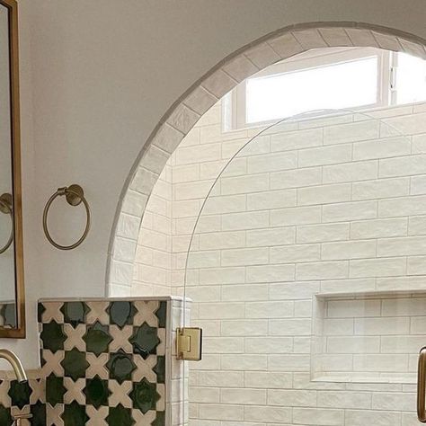 Kate Cavallero, KCDC LLC on Instagram: "I have loved following @thejoycejournal and her page documenting the revitalization of her beautiful home. This Spanish style bath has me swooning over the mix of lovely tiles, the vibrant green color and terracotta floor combo, and that dreamy arched shower. I adore how this bathroom is classic and maintains the integrity of the style of her home, yet it’s also super fun and whimsical. Swipe to see the before, I always love a good transformation. Bravo! Spanish Revival Powder Room, Arched Shower Opening Tile, Arched Shower Entrance, Arched Shower Opening, Tile Archway, Tiled Archway, Tiled Arch, Spanish Modern Homes, Spanish Colonial Bathroom