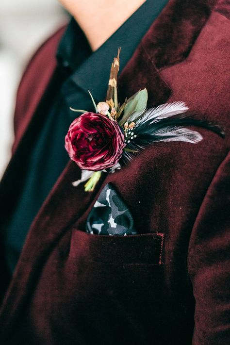 Burgundy velvet suit - boutonniere with feathers - Denver Clock Tower wedding #groom #groomsmen #mensfashion #groomsmenattire #wedding #weddingplanning #bestman #groomattire #groomstyle #groomoutfits #mensweddingoutfits #engaged Jewel Tone Mens Suit, Jewel Tone Suit Groom, Burgundy Velvet Suit Men, Jewel Tone Wedding Suit, Jewel Tone Boutonniere, Velvet Suit Wedding, Velvet Wedding Suit, Burgundy Wedding Suit, Maroon Wedding Suit