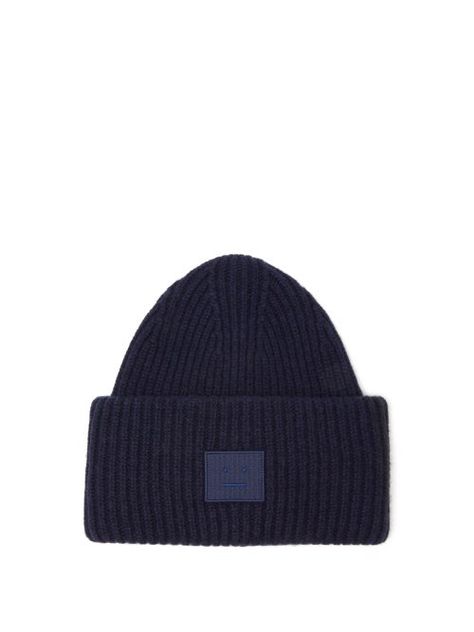 Acne Studios - Acne Studios' navy beanie hat is hallmarked with the signature Pansy Face patch which is designed to reflect the everyday expression of a Swedish citizen – a motif drawn by Jonny Johansson on a whim before a runway show. It's rib-knitted from wool with a relaxed crown and finished with a turned-up brim. 100% wool Navy Beanie, Face Patches, Blue Beanie, Patches Fashion, Face Logo, Chunky Wool, Wool Beanie, Navy Fashion, Knit Beanie Hat