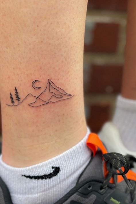 "Meaningful Couple Tattoos" Explore the diverse world of couple tattoos and find the perfect symbol of your love, ensuring your journey together is not just shared but also prominently displayed in the top choices for meaningful couple tattoos! See more ideas check out here! #meaningfulcoupletattoos #meaningfulcoupletattoo #coupletattoos Traveler Tattoos, Meaningful Couple Tattoos, Moutain Tattoos, Infinity Tattoos For Couples, Small Mountain Tattoo, Infinity Couple Tattoos, Tattoos For Couples, Unique Tattoo Ideas, Cool Wrist Tattoos