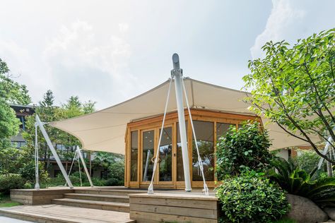 The tensile fabric structure can provide shelter and protection for remote wilderness luxury camp & hospitality & resort buildings. PS: Tensile fabric structure roof for wooden house . . . . . . #ecoliving #hoteltent #ecohotel #campingtent #outdoortent #ecolodg #woodenhouse #ecoresort #ecolodgeperu #ecocabina #resort #ecocamp #hospitality #glampingcolombia #campingout Tent Coffee Shop, Modern Tent Design, Mahakumbh 2025, Tent Architecture, Movable House, Tent Structure, House Canopy, Eco Cabin, Tent House