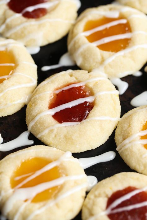 Lemon Thumbprint Cookies are a holiday staple! These easy cookies are sweet and tart with a melty texture. You will fall in love with this cute lemon cookies recipe! #lemon #thumbprint #cookies #lemoncookies #thumbprintcookies #lemoncookiesrecipe #thumbprintcookiesrecipe #easycookiesrecipe Lemon Thumbprint Cookies, Easy Lemon Cookies, Thumbprint Cookies Easy, Cookies Thumbprint, Cream Cheese Cookie Recipe, Lemon Cookies Easy, Easter Cookie Recipes, Alfredo Sauce Recipe Easy, Chocolate Thumbprint Cookies