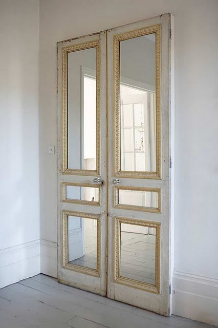 Pair of old doors with mirror inserts against a plain wall or on closet. Love this idea for our bedroom! Mirror Repurpose, Famous Interior Designers, Hampton House, Antique Doors, Diy Ikea, Closet Door, French Doors Interior, Door Makeover, Old Doors