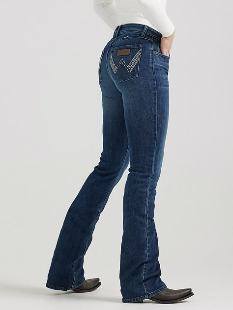 A BOOTCUT BRIMMING WITH RETRO VIBESMae places a contemporary twist on our cowgirl cool aesthetic. All Wrangler® jeans for women are designed to accentuate your best assets, but our women's Retro® jeans go above and beyond. Wrangler® Retro® jeans pay tribute to our Western heritage with the iconic details you know and love, including the leather patch and authentic W stitching on the back pockets. Plus, these women's bootcut jeans come with a figure-flattering, mid-rise fit that's truly versatile. With a variety of washes to choose from, you can easily make this throwback jean an everyday staple. Wrangler Outfits Woman, Bottom Jeans Outfit, Wrangler Jeans Women's, Bootcut Jeans Outfit, Bell Bottom Jeans Outfit, Retro Jeans, Womens Jeans Bootcut, Bootcut Jean, Bottom Jeans