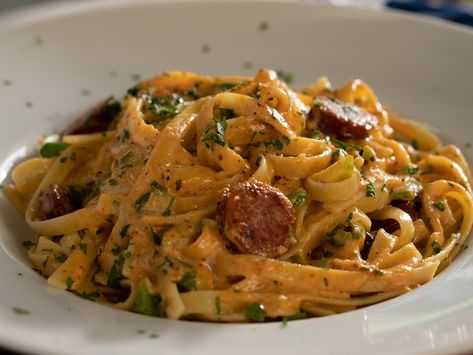 Spice up classic fettuccine alfredo by adding bold Cajun seasonings and andouille sausage. This comforting meal comes together fast enough to enjoy on a busy weeknight, but is impressive enough to serve guests. Cajun Fettuccine, Fetuccini Alfredo, Most Beautiful Restaurants, Fettucini Alfredo, Beautiful Restaurants, Fettuccine Alfredo Recipes, Valerie Bertinelli, Fettuccine Alfredo, Alfredo Pasta