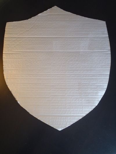 Shiny Cardboard Knight Shield - My Kid Craft Cardboard Knight Armor Template, Knight Shield Craft, How To Make A Shield Out Of Cardboard, Cardboard Shield Diy, Cardboard Shield, Cardboard Knight, Diy Viking Shield Cardboard, Chalkboard Pictures, Slip Pillowcase