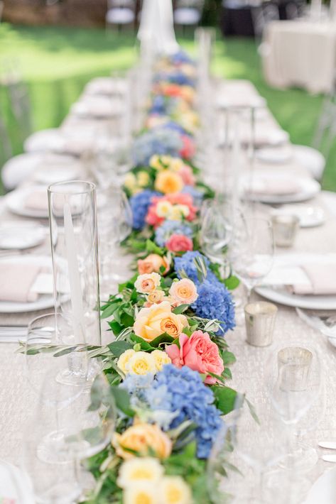 Flower Centerpieces Long Table, Peach And Blue Centerpieces, Pink Orange Yellow Blue Wedding, Wedding Long Table Flowers, Long Table Flower Arrangements, Periwinkle And Peach Wedding, Peach And Blue Wedding Flowers Centerpieces, Bridal Table Flowers Arrangements, Blue And Peach Floral Arrangements