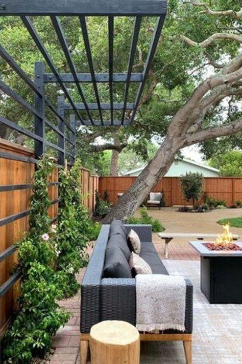 From the perfect space heaters to warm things up to the best decor to create that cozy vibe, here are 15 winter patio ideas that will make your outdoor area a delightful place that you actually want to spend time in, even when it's cold outside. #hunkerhome #winterpatioideas #patioideas #patio #patiodecorideas Privacy Fence With Pergola Top, Exterior Home Walkways, Trellis Pergola Ideas, Trellis Patio Cover, Decorative Trellis Panels, Oklahoma Backyard Landscaping, Modern Yard Design, Gorgeous Backyards, Cantilevered Pergola