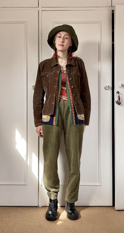 Corduroy pants, corduroy jacket, layering with pattern clashing tube top and button up. Cozy bucket hat, hair bows and boots Corduroy Pants With Boots, Casual Wizard Outfit, Bucket Hat Hair, Adventurer Outfit, Pattern Clashing, Jacket Layering, 70s Corduroy, Khaki Corduroy Pants, Corduroy Pants Outfit