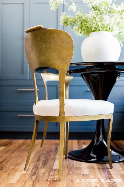 Stunning gold leaf dining chairs are seated in front of a glossy black round top dining table topped with a large white vase. Chairs For Dining Room, Metal Dining Room Chairs, Gold Dining Chairs, Alice Lane Home, Alice Lane, Transitional Dining Room, Painted Chairs, Dining Table Black, Dining Table Top