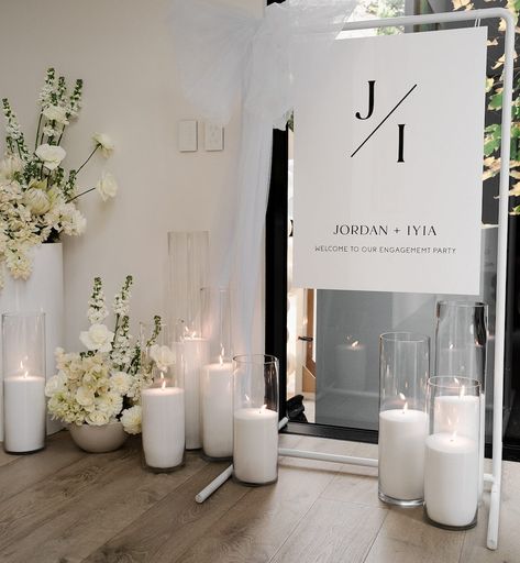 One of the candle installations we did for @iyialiu and Jordan’s stunning engagement party, was for their welcome sign. This entrance install greeted guests on arrival, and ended up being a beautiful backdrop for guest photos. To elevate and complement wedding or event signage, consider adding a range of our luxury candles. It just adds that magic touch x @milliecreative.nz @devonportflowers • • • • #engagement #engagementparty #eventcandles #weddingcandles #weddingsignage #seatingsign ... Entrance Signage Wedding, Wedding Welcome Backdrop, Engagement Party Candles, Wedding Welcome Sign With Candles, Engagement Party Signage, Engagement Party Entrance, Engagement Party Photo Backdrop, Luxury Engagement Party, Engagement Signage