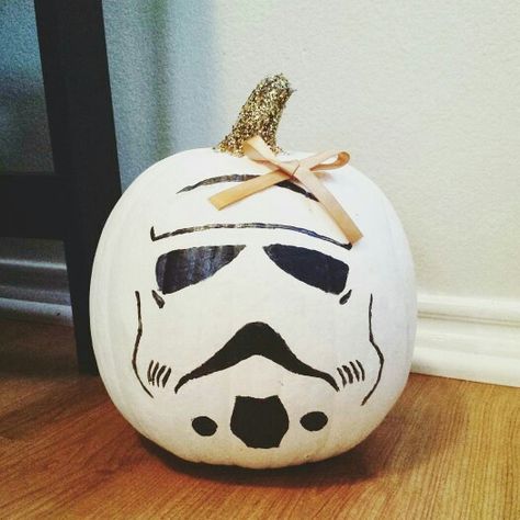 Starwars Stormtrooper pumpkin. This does not need a bow or a glitter stem. What is wrong with people Star Wars Pumpkin Painting Ideas, Starwars Pumpkin Painting Ideas, Darth Vader Pumpkin Painting, Stranger Things Painted Pumpkin, Starwars Pumpkins, Star Wars Pumpkin Painting, Storm Trooper Pumpkin, Stormtrooper Pumpkin, Darth Vader Pumpkin