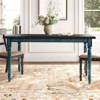 Whether you’re looking for a dining table replacement or are filling out a new space, this Bastion 59" Dining Table is just what you’ve been looking for. Made from solid and engineered wood, it showcases a clean-lined rectangular tabletop with visible wood grain for a rustic look. Down below, four turned legs in contrasting colors round out this table in traditional style, making it the perfect pick for French country aesthetics. This table comfortably seats six and requires full assembly. But o Farmhouse Dining Table, Nursery Furniture Sets, Solid Wood Dining Table, Laurel Foundry Modern Farmhouse, Farmhouse Dining, Table Height, Kitchen Chairs, Extendable Dining Table, Bench Table