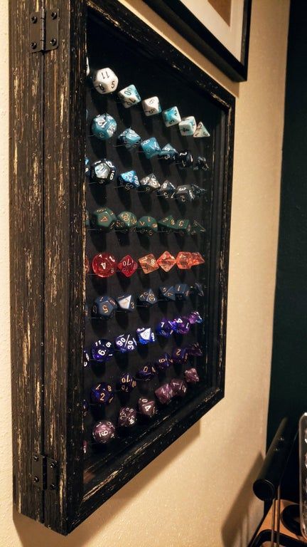 [OC] Carefully placed 126 straight pins to display 9 sets of dice in a shadowbox for my husband's gallery wall. : DnD Dnd Room Ideas, Dungeons And Dragons Room, Dnd Decor, Dnd Room, Dnd Diy, Nerd Decor, Dungeon Room, Board Game Room, Nerd Room