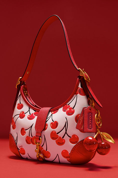 ‘Tis the season to give the gift that keeps on giving – a very cherry Hamptons Hobo Bag. From formal events to casual hangs, be sure to add this cherry on top. 🍒✨ #CoachNY Coach Cherry Collection, Cherry Coach Bag, Vasity Jacket, Red Coach Bag, Purse Collection, Pop Tabs, Dream Bags, Luxury Bags Collection, Bags Game