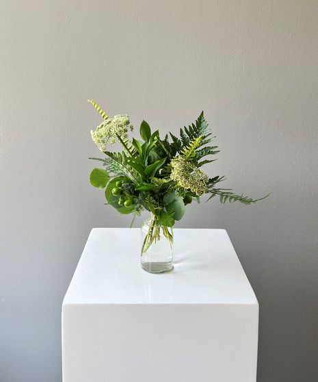 wcbv09, wild greens budvase A simple bud vase adorned with a varitey of greenery and queen anne's lace to coordinate your special event. Perfect for the center of a small round table, interspersed around larger florals, next to your cake, or add a few to decorate the bar! Bud Vase Greenery, Wedding Round Table Flowers, Greenery Bud Vases, Simple Bud Vase, Greenery Vase, Engagement Party Table, Wedding Pallet, Bud Vases Wedding, Small Round Table