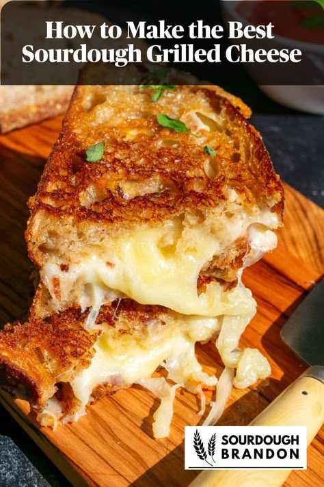 Two slices of sourdough grilled cheese with gooey cheese on a cutting board. Sourdough Grilled Cheese, Grilled Cheese Recipes Gourmet, Homemade Grilled Cheese, Perfect Grilled Cheese, Gourmet Grilled Cheese, Cheese Sandwich Recipes, Sourdough Sandwich, Best Grilled Cheese, Grilled Cheese Recipes