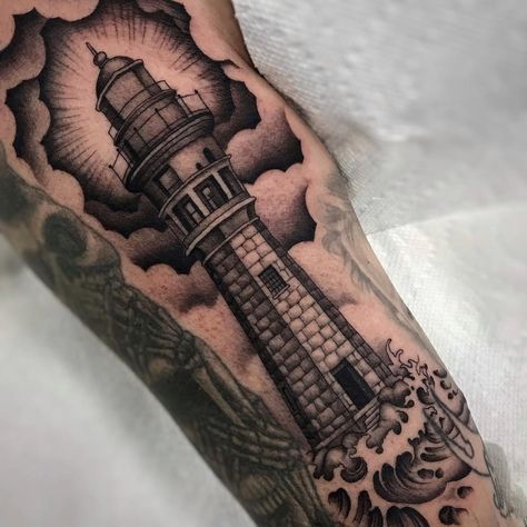 Tattoo uploaded by Tattoodo • Lighthouse tattoo by Shaun Topper #ShaunTopper #NauticalTattoos #sailortattoos #sailors #traditionaltattoos #traditional #AmericanTraditional #nautical #lighthouse #upperarm #arm #bicep • 1027558 • Tattoodo Traditional Nautical Tattoo, Traditional Sailor Tattoos, Nautical Tattoo Sleeve, Island Tattoo, Lace Tattoo Design, Sailor Tattoos, Lighthouse Tattoo, Sea Tattoo, Clever Tattoos