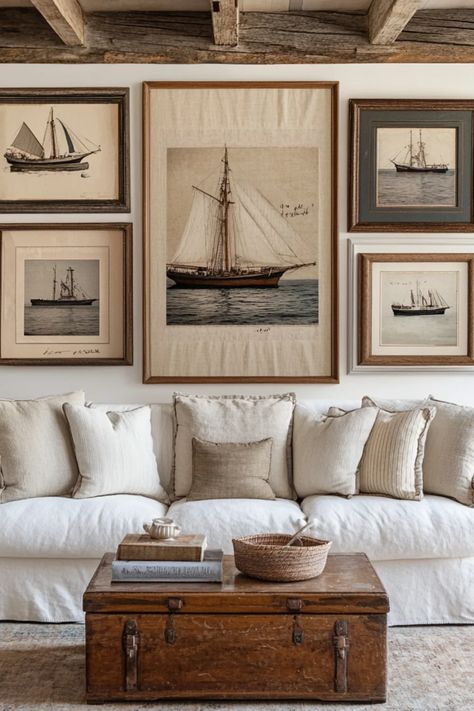 Explore vintage coastal gallery wall ideas that feature ocean-themed artwork and nautical elements, creating a refreshing beach home vibe Old Money Beach House Interior, Cozy Nautical Living Room, Art Wall Arrangements, Vintage Nautical Decor Living Room, Coastal Man Cave, Coastal Home Designs, Vintage Beach Artwork, Nautical Home Decor Coastal Style, Coastal Beach Color Palette