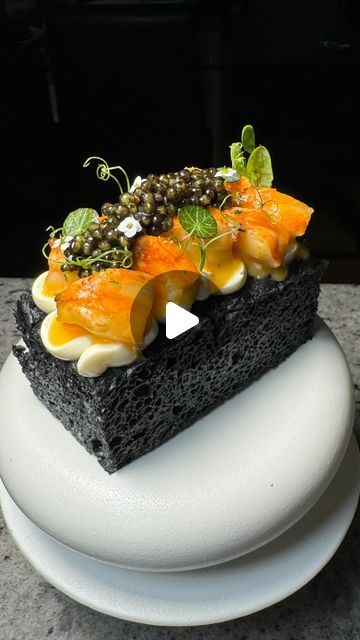 The Boujee Foodie on Instagram: "This is my stunning lobster roll on charcoal focaccia and smoked crème Friache. Featuring a very special ethically harvested ‘In Vivo’ Caviar, a process which keeps sturgeon alive, safely producing caviar pearls for the next seasons to come. The pearls are beautiful and larger in size and the taste is absolutely amazing. From @belugacaviar_au 🩵

The focaccia is made with activated charcoal and baked with rosemary and rock salt. The lobster is poached in lobster infused butter which then is used as a base for a sauce coating with egg yolk and salt before adding herbs and spices and topped on the focaccia. A beautiful lobster roll, and a stunning way to present it. 

#lobster #lobsterroll #caviar #invivo #ethicallymade #ethicallysourced #focaccia #bread #bre Starter Platter Ideas, Caviar Pearls, Infused Butter, Focaccia Bread, The Lobster, Lobster Roll, Rock Salt, Herbs And Spices, Activated Charcoal