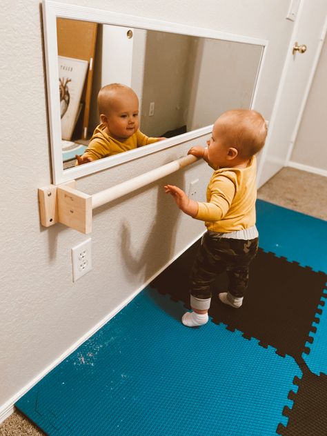 DIY baby pull up bar for Montessori based play room Baby Playroom Mirror, Montesorri Room Ideas, Monestorri Nursery, Montessori Infant Playroom, Montessori Bedroom Diy, Infant Pull Up Bar Diy, Playroom For Infants, Diy Montessori Playroom, Diy Montessori Pull Up Bar