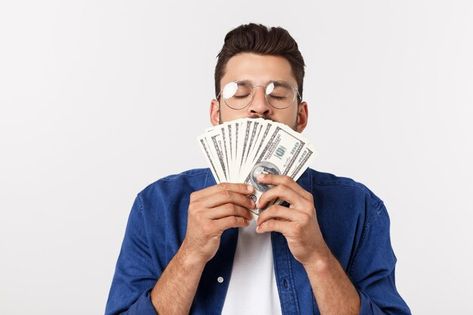 Attractive man is holding cash money in ... | Premium Photo #Freepik #photo #money-man #rich-people #man-standing #excited-man Cash Money, Psd Icon, Money Cash, His Hands, Premium Photo, White Background, Hold On, Stock Photos, Money