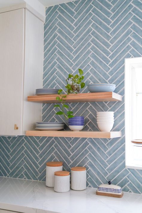 Miami Modern Kitchen with Bold Blue Herringbone Backsplash designed by KJ Design Collective. This kitchen was transformed by adding a bold backsplash, ample seating, dramatic wallpaper and floor to ceiling storage solutions. Blue Herringbone Backsplash, Blue Tile Backsplash Kitchen, Blue Backsplash Kitchen, Blue Kitchen Tiles, Coastal Kitchen Decor, Decor Ideas Kitchen, Wallpaper Kitchen, Blue Backsplash, Kitchen Designer