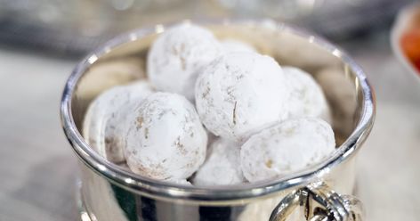 Martha Stewart makes rich nut-and-butter Noël nut balls rolled in powdered sugar to resemble miniature snowballs. Walnut Snowball Cookies Recipe, Butter Pecan Snowballs, Noel Nut Balls, Martha Stewart Eggnog Recipe, Nutmeg Noel Cookies, Martha Stewart Noel Nut Balls, Nut Free Snowball Cookies, Martha Stewart Eggnog, Nut Balls Recipe