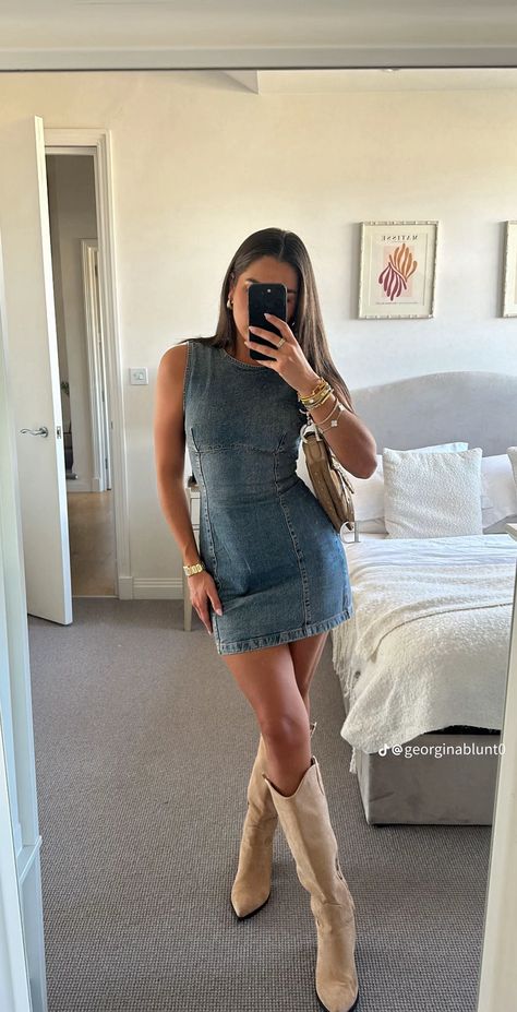 Denim Shirt And Dress Outfit, Cute Fancy Dinner Outfits, Night Out Cowboy Boots Outfit, Country Party Theme Outfit, Denim Dresses Outfit, White Jean Dress Outfit, Jean Skirt And Cowboy Boots Outfit, Golden Goose Sneakers Outfit Dress, Cool Girl Country Concert Outfit