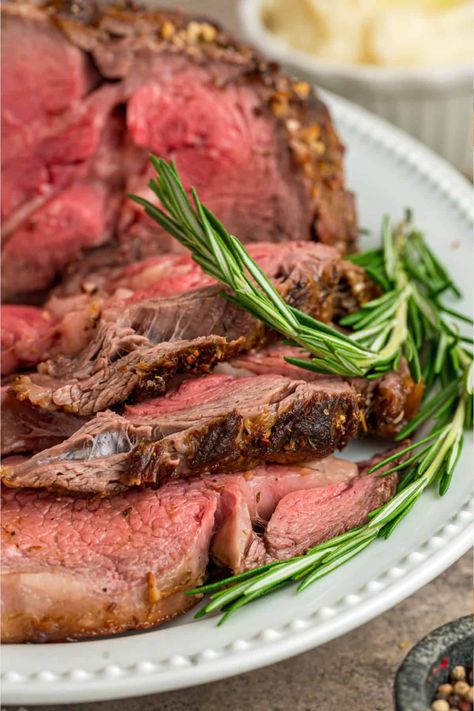 Prime rib roast is seared and then coated in garlic herb butter in this Prime Rib Recipe. The end result is tender, juicy, and mouthwateringly delicious slices of meat. Perfect for holidays and special occasions! Reverse Prime Rib Recipe, Keto Prime Rib Roast, Prime Rib In Dutch Oven, Prime Rib No Bone Recipe, Blackened Prime Rib Recipe, Butter Rub For Prime Rib Roast Beef, Dutch Oven Prime Rib Roast, Rib Roast Recipe Bone In Crockpot, Small Prime Rib Roast Recipe