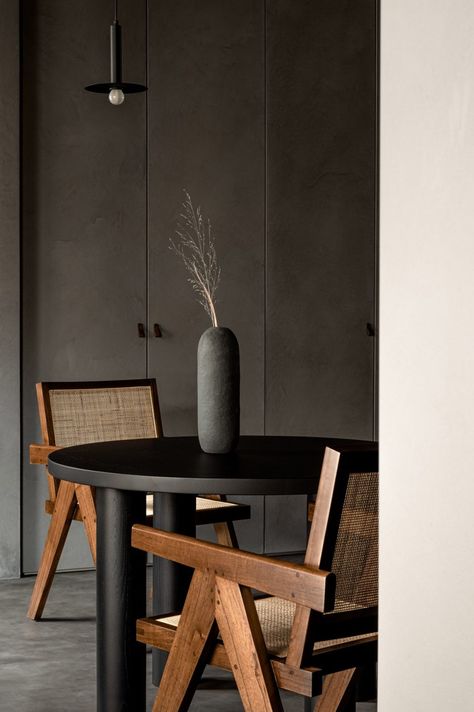 Olga Fradina uses dark colours to create cosy Kyiv apartment Swedish Interiors, Tea Lounge, Hall And Living Room, Rattan Lounge Chair, Shower Units, Dark Colours, Local Furniture, Wooden Ceilings, Wooden Dining Tables