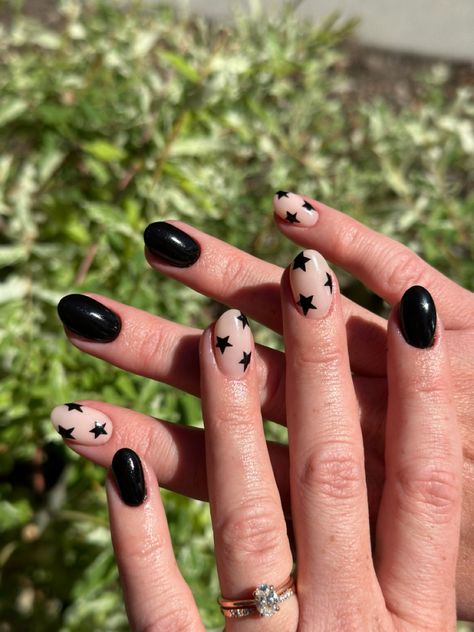 Solid black nails with some sheer nails that have black stars on them Black Star And Moon Nails, Short Black Star Nails, Easy Black And White Nail Designs, Natural Nails With Stars, Black And Silver Star Nails, Black Nails Stars, Black Stars Nails, Stars Nails Design, Black Nails With Stars