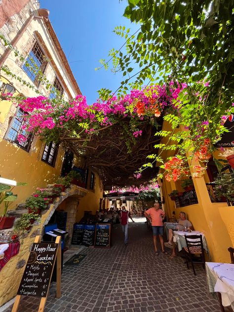 A beautiful Bougainvilla canopy in the heart of Old Town Chania located on the island of Crete, Greece. Old Town Chania, Chania Crete Greece Old Town, Chania Aesthetic, Maleme Crete, Crete Greece Aesthetic, Crete Malia, Syros Greece, Chania Crete Greece, Chania Greece