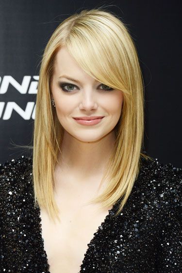 Sleek Locks:  This starts with your blowdryer.  To reduce static, bust frizz, and boost shine, be sure to choose one with ceramic technology.  For the look seen here, part your hair to the side and use a paddle brush for just the right amount of volume and body. Emma Stone Blonde, Emma Stone Hair, Sarah Drew, Hair Evolution, Straight Blonde Hair, Long Bangs, Long Bob Hairstyles, Anne Hathaway, Emma Stone