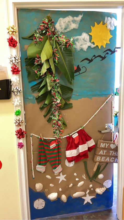 Beach Santa Door Decoration, Beach Christmas Office Decorations, Hawaiian Christmas Door Decoration, Tropical Christmas Door Decorations, Tropical Door Decorations Classroom, Christmas Doors For Work, Tropical Christmas Decorations, Summer Door Decorations, Diy Christmas Door Decorations