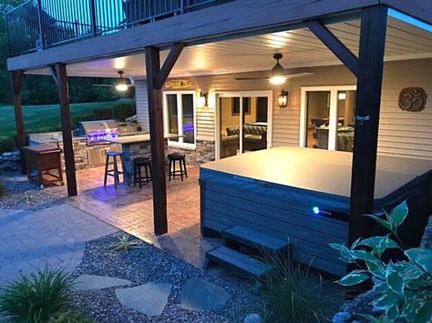 Check out this beautiful outdoor kitchen. Under Deck Oasis keeps it dry and leak-free all year long, perfect for the hottub! Outdoor Kitchen Under Deck, Walkout Basement Patio, Deck Oasis, Patio Under Decks, Under Deck, Hot Tub Patio, Remodel Diy, Building A Porch, Under Decks