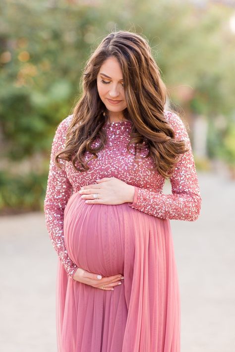 Mom in pink dress holds belly and looks down. This session was absolutely stunning. The love this mama has for her new sweet baby is incredible. A mama's love is the best! Click to see more from this maternity session photographed by Rebecca Rice Photography! Maternity Photoshoot Dresses Indian, Mom To Be Dress Ideas, Baby Shower Indian Outfits For Mom, Meternati Dress, Maternity Indian Wedding Outfits, Pregnant Women Dresses Indian, Dress Ideas For Pregnant Women, Party Dress For Pregnant Women, Maternity Dresses Photoshoot