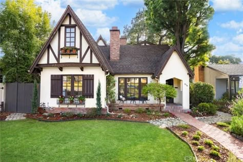 Small Tudor Style Homes, English Tudor Cottage, Round Doorway, Metal Window Boxes, Tudor House Exterior, English Tudor Homes, Monrovia California, Gothic Chandelier, Tudor Cottage