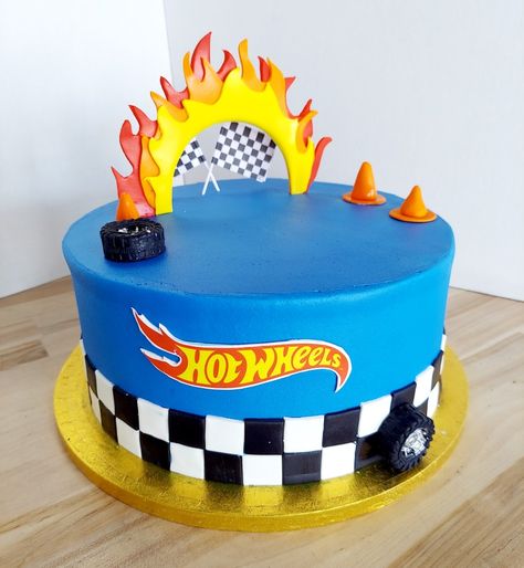 This Hot Wheels cake is perfect for your little man's birthday. Iced in buttercream with fondant design details. #americandreamcakes #customcakes #hotwheels #DecoPac Hotwheels Buttercream Cake, Hot Wheels Cake Design, Small Hot Wheels Cake, Boy Birthday Cake Design, Hot Wells Carros, Hotwheels Birthday Cake, Hot Wheels Cupcakes, Bolo Hot Wheels, Wheels Cake