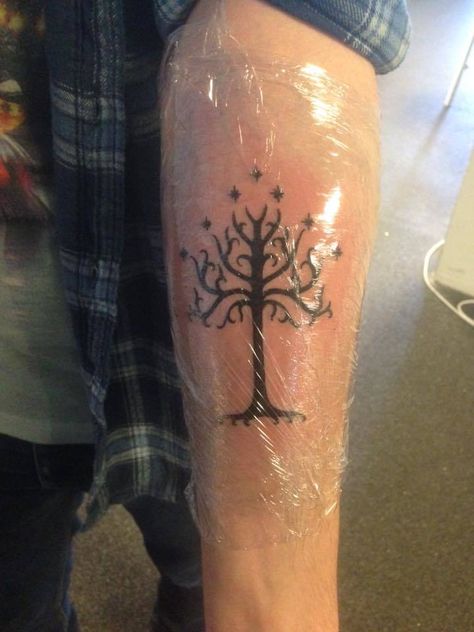 Got the White Tree of Gondor for my first tattoo (Done by Jayvee The Rising Bastards Nijmegen) #Tattoos https://t.co/tDNJ98dl9I Please Re-Pin It! Fangirl Tattoos, Gondor Tattoo, Tree Of Gondor Tattoo, Tolkien Tattoo, White Tree Of Gondor, Ring Tattoo Designs, Tree Of Gondor, Lotr Tattoo, Beautiful Tattoo Designs