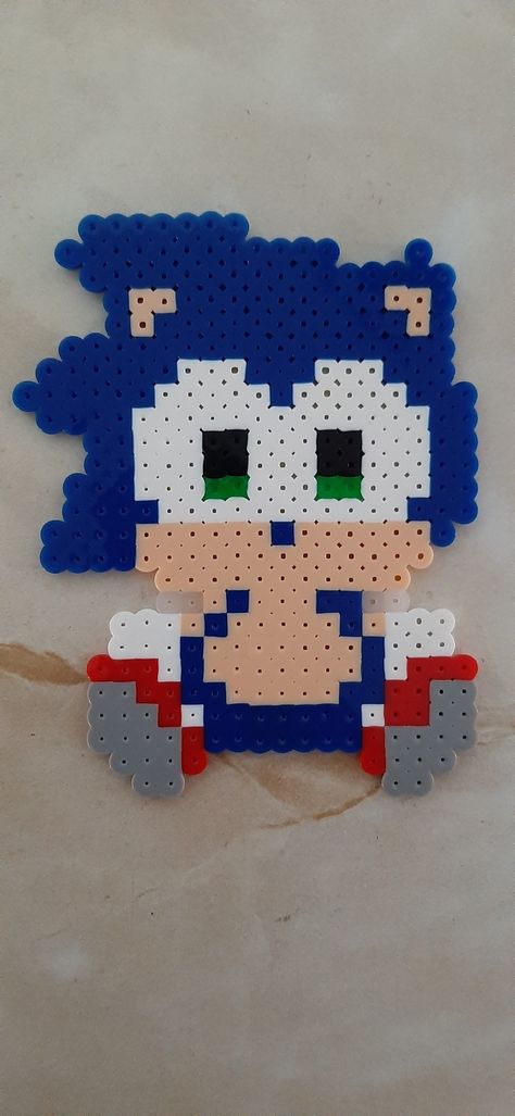 Sonic baby perler beads Sonic Perler Beads Pattern, Sonic Pearl Beads, Sonic Fuse Beads, Sonic Beads Pattern, Perler Bead Sonic, Sonic Perler Bead Patterns, Sonic Crafts, Sonic Perler Beads, Perler Bead Mario