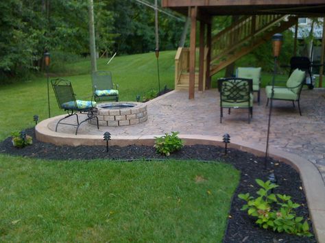 Patio Ideas With Fire Pit, Concrete Patio Ideas, Fire Pit Gallery, Outside Fire Pits, Concrete Patio Designs, Sloped Yard, Concrete Patios, Fire Pit Landscaping, Standing Lamps