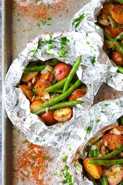 20 Foil Packet Recipes Crafted for the Oven, Grill, or Campfire Sausage Potatoes Green Beans, Potato And Green Bean, Tin Foil Dinners, Easy Grill, Hobo Dinners, Foil Pack Dinners, Foil Packet Dinners, Sausage Potato, Foil Pack Meals