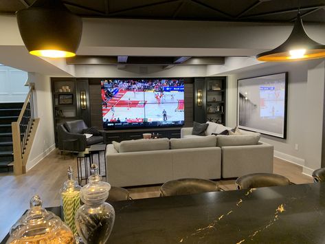 Classy Man Cave Basement, No Window Basement Ideas, Basement Entertainment Area, Entertainment Basement Ideas, Multiple Tv Wall Ideas Man Cave, Tv Den Room Ideas, Basement Entertainment Wall, Basement Tv Wall Ideas, Aesthetic Basement