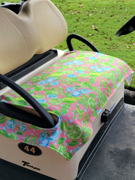 "\"Limes on the green\" golf cart seat cover.   Pink fleece with green limes & ice cubes, just missing a lowball or margarita glass! This listing is for the print in the first main photo.  Any other prints shown can be purchased in my Esty shop here: https://www.etsy.com/shop/TheBoujeeBirdie?ref=seller-platform-mcnav The perfect gift for the golfer in your life!  This golf cart seat cover is a must for those hot & sweaty days on the course.  Legs won't stick to the vinyl seat & great for the cold days on the course so you're not sitting on the cold vinyl golf cart seat.  This golf cart seat cover works for all golf cart scootin around whether you are on the course, farm, barn, neighborhood, or at my favorite place the beach!  Please select your option in the drop-down box when placing your Beach Golf Cart, Golf Cart Seat Covers, Golf Girl, Golf Cart Seats, Ball Ideas, Golf Stuff, Beach Buggy, Beach Golf, Pink Fleece