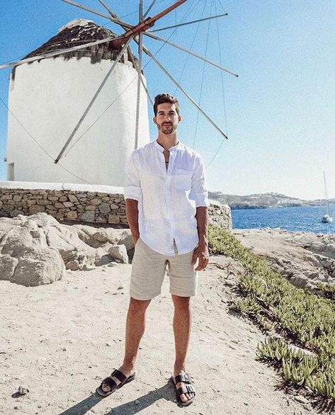 Picture of a light vacation look with a white linen shirt, neutral linen shorts and black birkenstocks is a cool idea for having a rest Men Maldives Outfit, Dubai Men Outfits Ideas, Greece Vacation Outfit Men, Maldives Men Outfit, Beach Men Outfit Beachwear, Beach Party Men Outfit, Maldives Outfit Ideas For Men, Men's Beach Wear, Mykonos Outfit Men