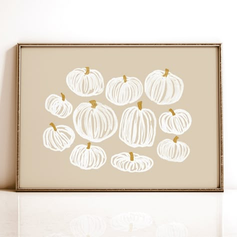 "Neutral Pumpkin Halloween Printable Wall Art. A beautiful grouping of white and gold pumpkins on a beige background. This artwork was originally hand drawn by Aubrey, the owner and designer of Little Lady Print Shop. For an added touch of coziness and depth, consider pairing it with one of my fall landscape paintings or typography prints. Please note this is a high resolution 300 dpi instant digital download for printable artwork. Printing Tips: Artwork looks best when printed on fine art paper Sharpie Pumpkin Art, Diy Fall Art, Fall Wall Art Diy, Modern Halloween Decor, Fall Landscape Painting, Thanksgiving Wall Art, Neutral Fall Decor, Modern Halloween, Fall Wall Art