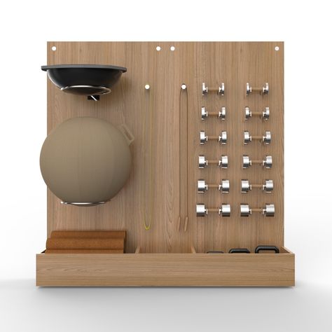 A completely bespoke design for a home gym or studio, made in Limed Oak & Stainless Steel. Originally designed for a specific project, the storage wall has been conceived to fit in an alcove in our client’s gym, and holds vertically a Technogym Balance DomeVluv Stov Ball, Skipping Rope, Power Bands and of course a bespoke set of our Paragon Studio Diabolo Dumbbells. At the base 3 cubbies store Airex Cork Yoga mats and Eleiko Kettlebells. Minimal Home Gym Design, Gym Furniture Design, Home Gym With Barre, Wall Gym Storage, Fitness Studio Storage, Classy Gym Interior, Corner Gym Ideas, Physio Gym Design, Yoga Ball Storage Ideas